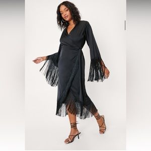 Black wrap dress with fringe.